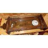 A circa 1900 Vienna walnut regulator clock, with typical glazed trunk door, white enamel dial,