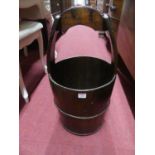 An Eastern rustic stained pine and metal bound grain bucket