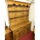 A contemporary joined light elm Welsh dresser, having three-tier open plate rack, fitted with five