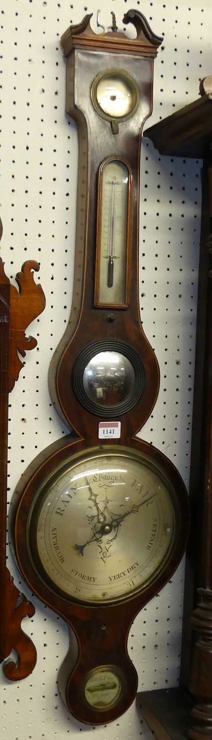 An early 19th century mahogany four dial wheel barometer, the lower silvered dial signed