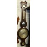 An early 19th century mahogany four dial wheel barometer, the lower silvered dial signed