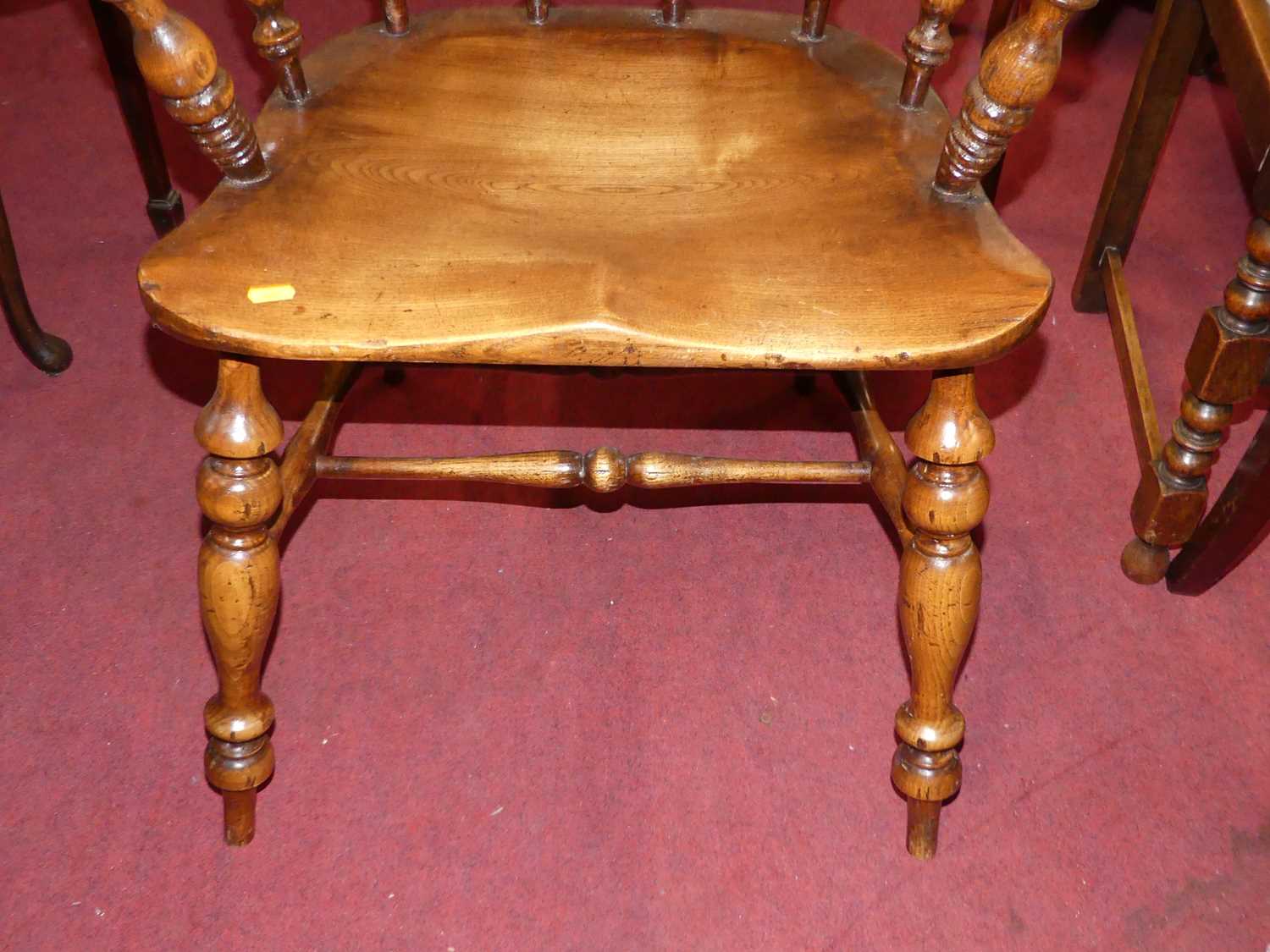 An elm, beech and fruit wood comb back Windsor chair, raised on turned supports to H-stretcher, - Image 4 of 5