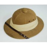 A post WW II Foreign Service Wolseley pattern pith helmet of six panel cork construction with