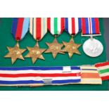 A collection of five WW II medals to include 1939-1945 Star, Africa Star, Italy Star, France and