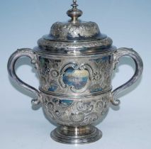 A large Victorian silver plated trophy cup and cover, the ogee domed cover with squat circular