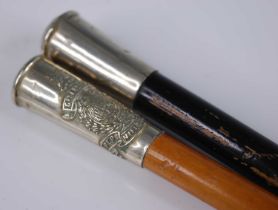 An early 20th century swagger stick, having a malacca shaft and nickel cap with crest for the