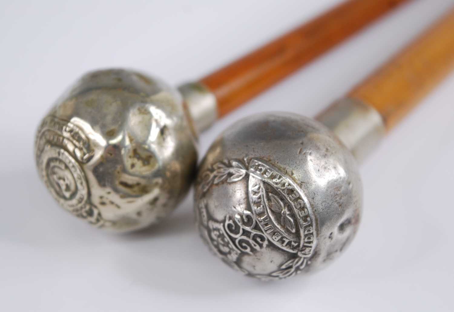 An early 20th century swagger stick, having a malacca shaft and nickel cap with Middlesex Regiment