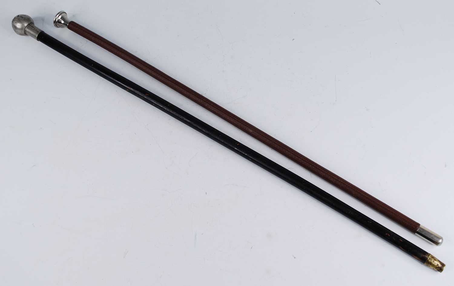 A early 20th century swagger stick, having an ebonised shaft and silver plated cap with crest for - Image 2 of 2