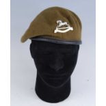 A collection of five berets from various regiments to include Royal Anglian, Queen's Own Hussars and