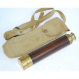 A late 19th/early 20th century mahogany clad and lacquered brass three drawer military telescope,