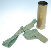 A 1944 pattern webbing holster dated 1945, on webbing belt, together with a WW II 25Pr artillery