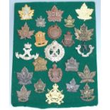 A collection of Canadian Regiment cap badges and insignia to include 48th Highlanders 15th