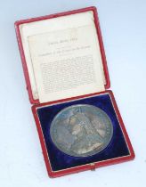 A Queen Victoria 1887 jubilee medal, obv; Victoria jubilee bust, rev; throned figure representing