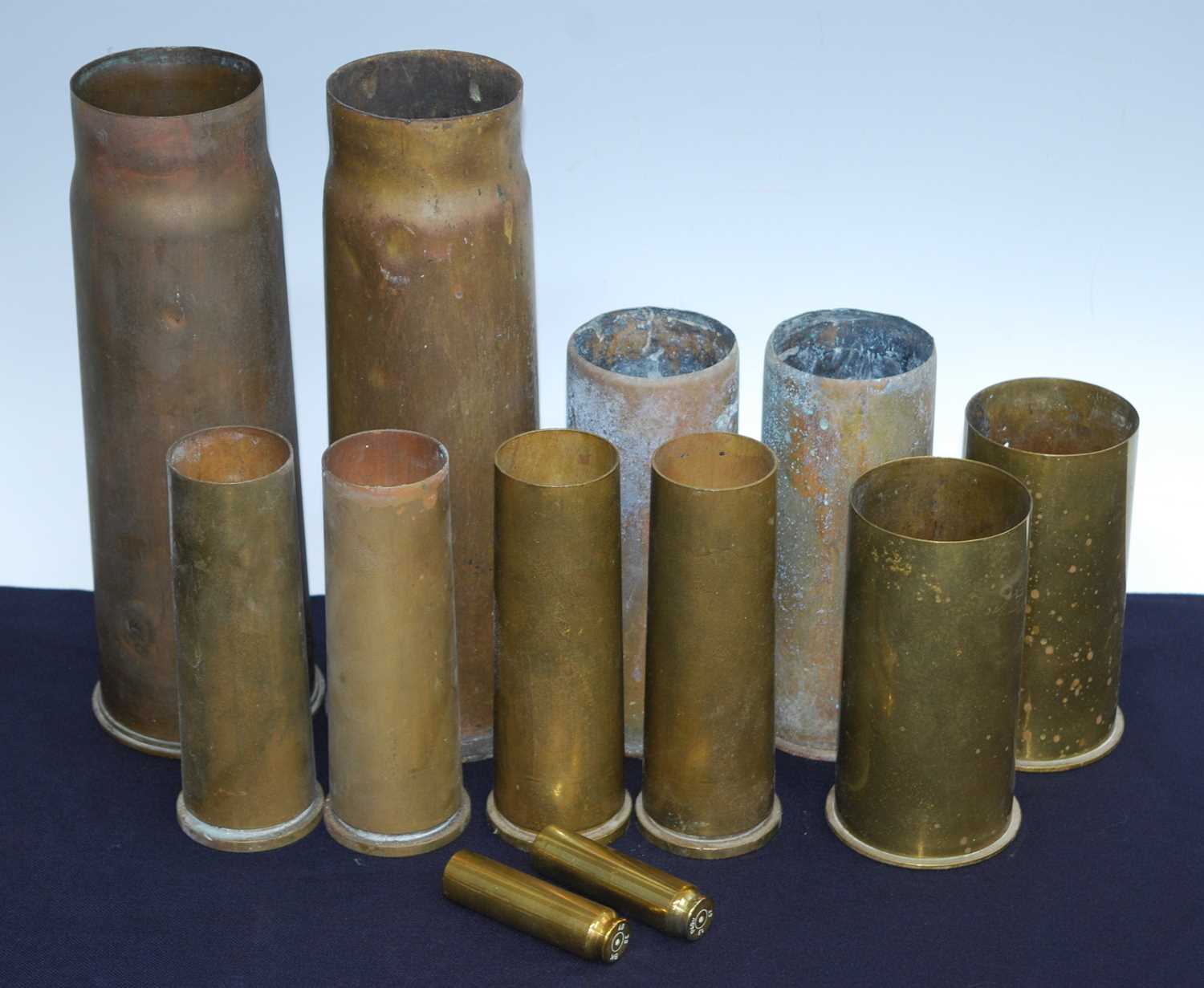 A WW I 13 PR 9 CWT artillery shell, dated 1917, h.29.5cm, together with eleven other shells. (12)