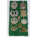 A small collection of cap and collar badges, to include Argyll and Sutherland Highlanders, King's