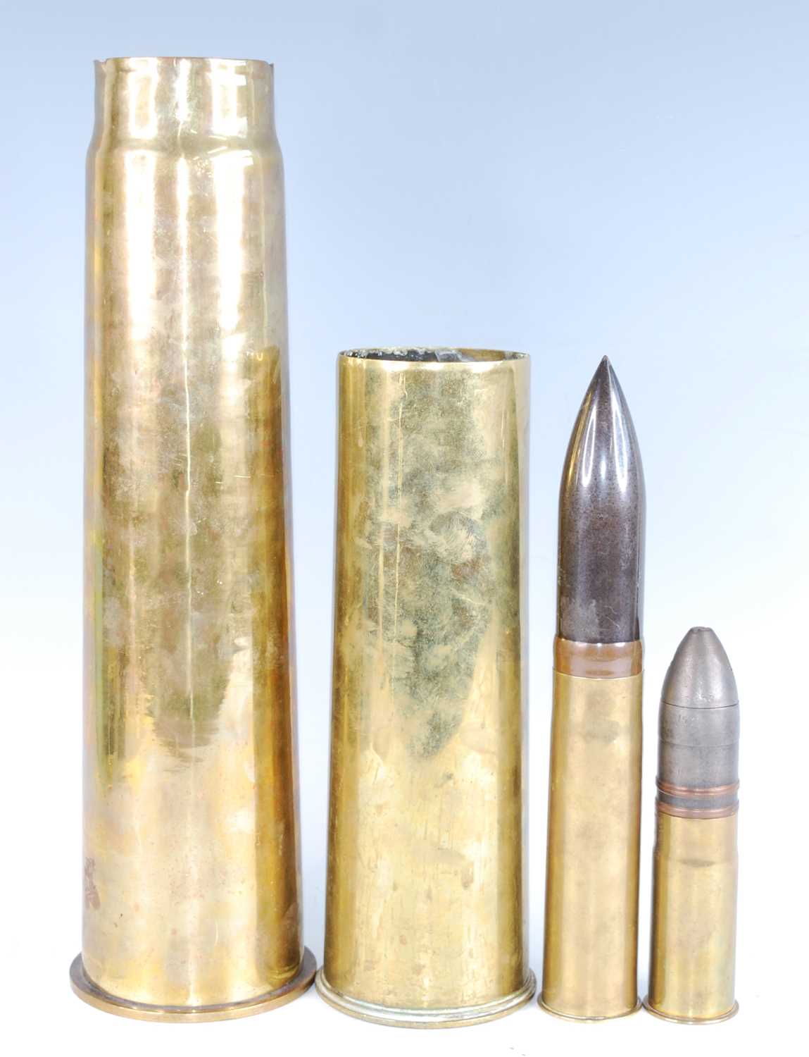 A WW I French 37mm pom pom shell, together with a British 2 Pr shell and two WW I shell cases