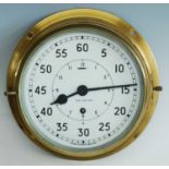 A 20th century brass cased Naval bulkhead clock, the circular enamel dial with outer minute and
