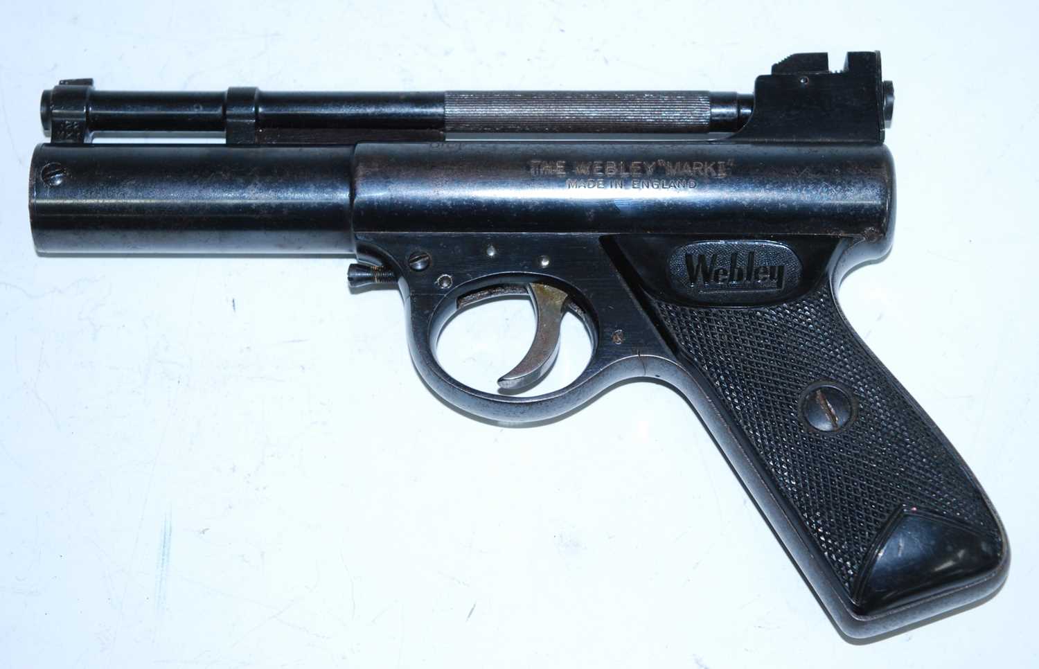 The Webley "Mark I" .22 calibre air pistol, having a 17cm sprung barrel and chequered bakelite