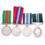 A group of four WW II medals, to include Defence, War (boxed), India Service medal and Air