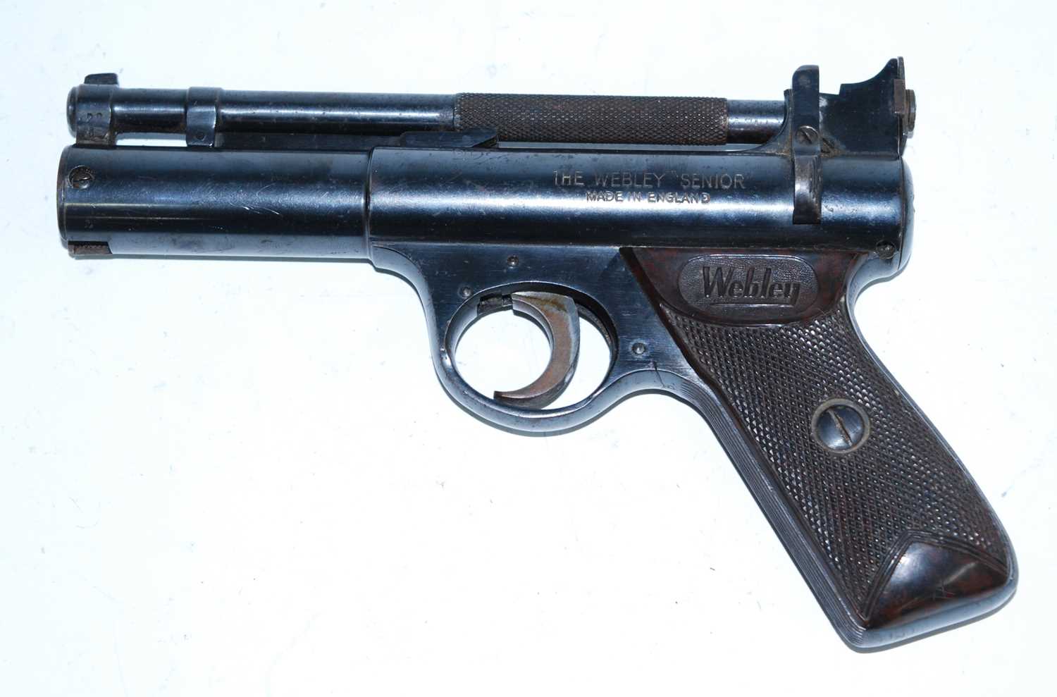 The Webley "Senior" .22 calibre air pistol, having a 17cm spring barrel and chequered bakelite