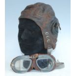 A mid-20th century R.A.F. type C leather flying helmet, the chamois interior marked No. 3, 21849,