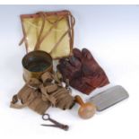 A small collection of miscellaneous items, to include a pair of puttees, a WW II artillery shell,