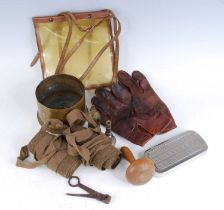 A small collection of miscellaneous items, to include a pair of puttees, a WW II artillery shell,