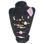 A collection of sweetheart brooches and pins, to include Royal Artillery, Gloucestershire