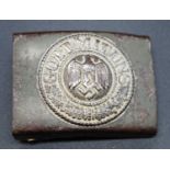 A German Heer 1937 pattern belt buckle, the central eagle and swastika with Gott Mit Uns and