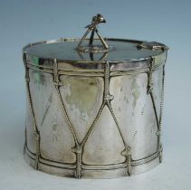 An early 20th century silver plated biscuit barrel, in the form of a military drum, the hinged cover