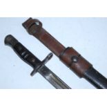 A 1913 pattern Remington bayonet, the 43cm single edged fullered blade stamped to the ricasso