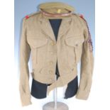 A WW II Battle Dress Blouse with Labour Corps collar badges, together with a similar pair of
