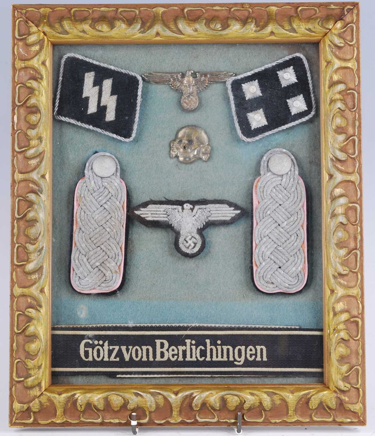 A framed display of items relating to The 17th SS Panzergrenadier Division, to include Totenkopf,