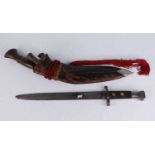 A British 1888 pattern bayonet, having a 29cm blade, rounded at the tip possibly for drill purposes,