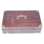 A 19th century mahogany and brass bound pistol case, the hinged lid with recessed brass handle,