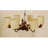 A David Hunt Lighting six light stag antler chandelier, w.70cm, together with a three light example,