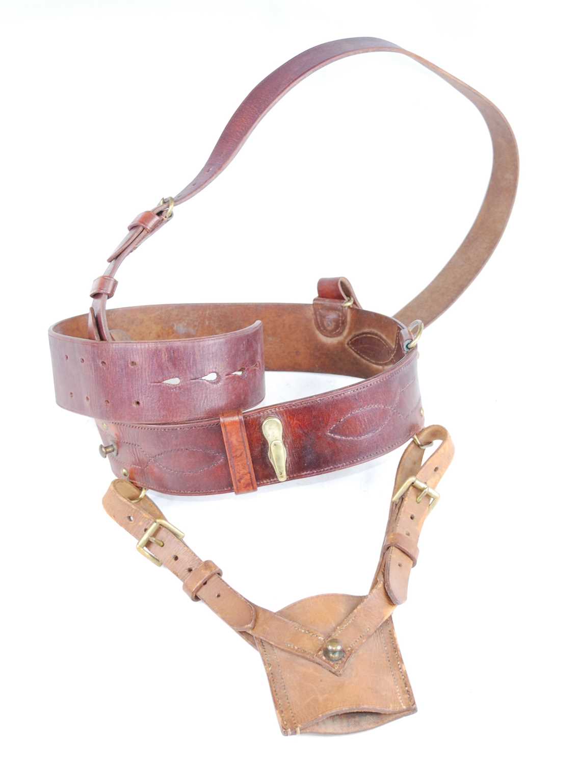 A brown leather and brass mounted Sam Browne belt with cross strap and sword frog.