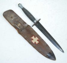 A British Fairbairn-Sykes 3rd Pattern Commando fighting knife, having a 17cm double edged spear-