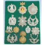 A collection of cap badges and insignia, mainly being British Army and Highland Regiments to include