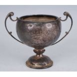 A George V silver trophy cup, having a globular body with twin scrolling handles, on a domed foot