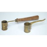 A 19th century French brass powder measure, on a turned wooden handle, 13cm, together with one other