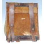 A German Third Reich tornister, of canvas construction with leather straps and animal fur flap.