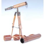 An early 20th century leather clad brass three drawer telescope, with leather lens covers, 82cm (