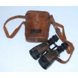 A pair of WW I military binoculars, with War Department mark and numbered S.3 61105, housed in a