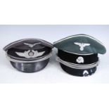 A reproduction German Luftwaffe Officer's peaked cap, togetrher with an SS example. (2)