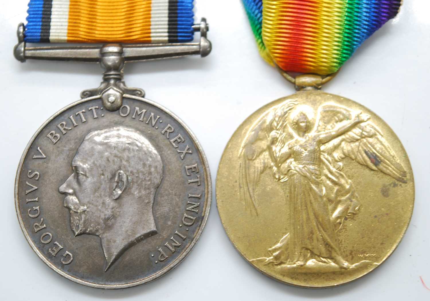 A WW I British War and Victory pair, naming 18739 PTE. G.W. HOWE SUFF. R. (2)