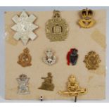 A small collection of cap and collar badges, to include King's Own Scottish Boarderers, Royal Army