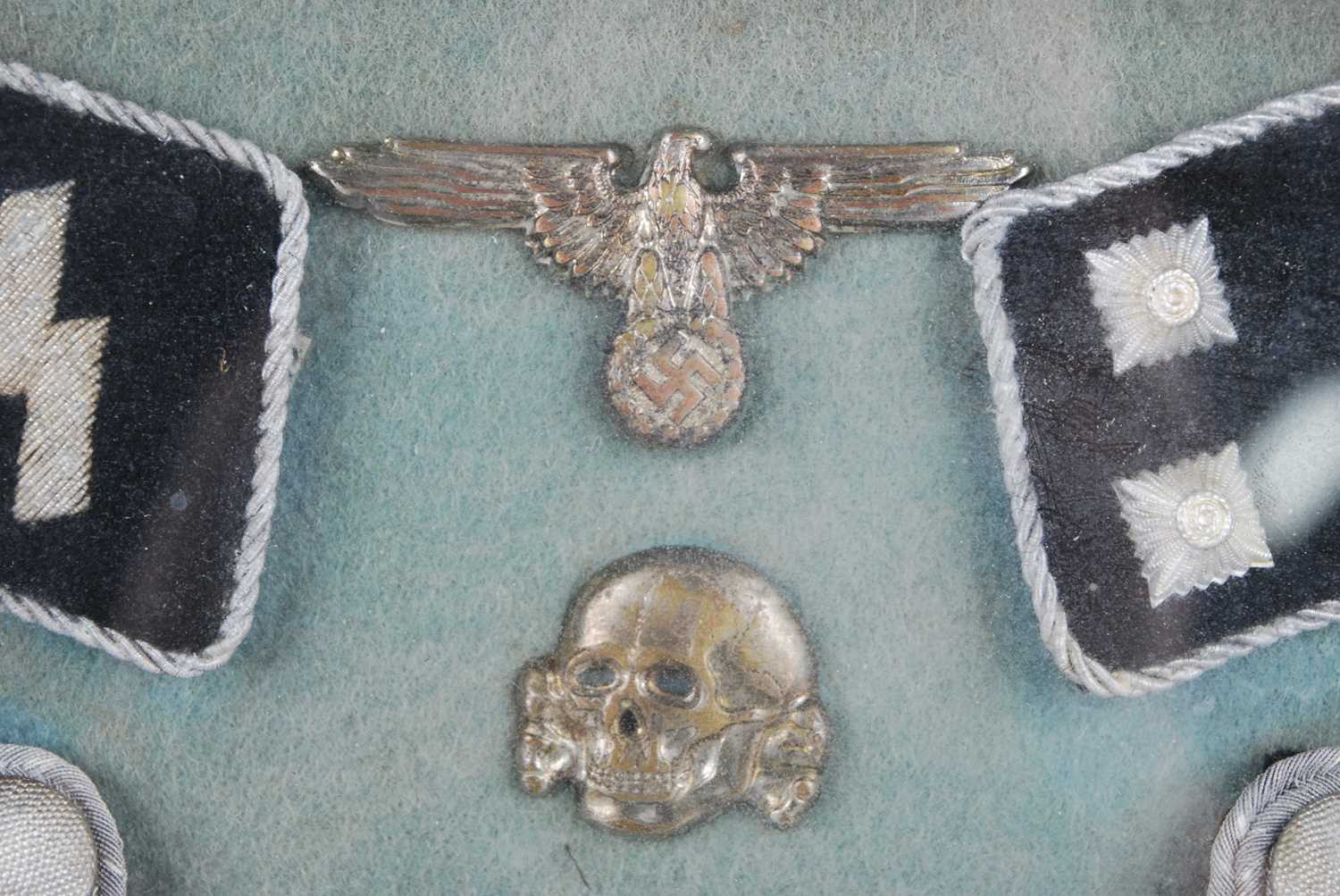 A framed display of items relating to The 17th SS Panzergrenadier Division, to include Totenkopf, - Image 2 of 7