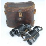 A pair of WW I French Bino Prism binoculars by E. Leger of Paris, S.I. 93859, in a leather case