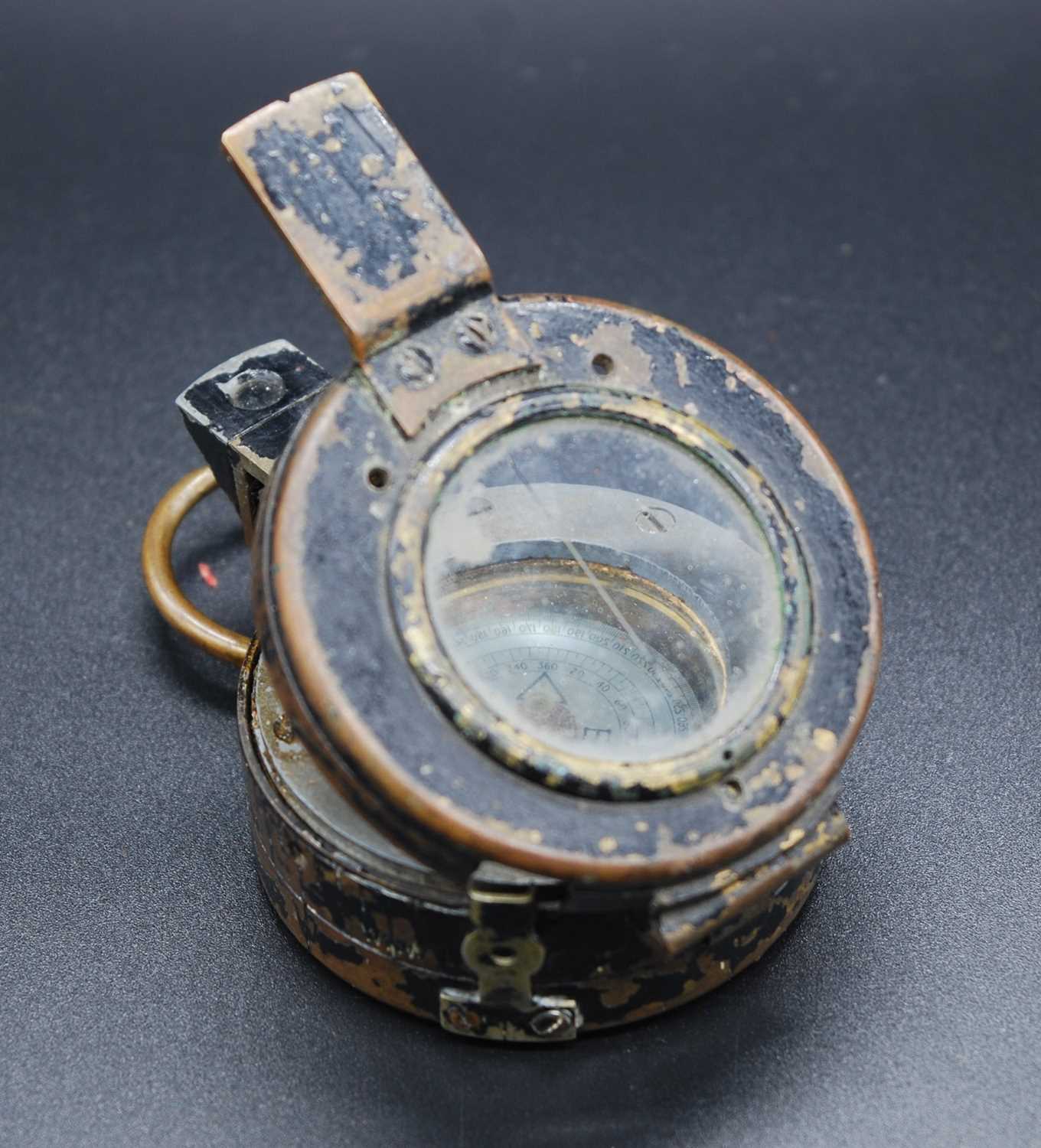 A WW II Verner's Pattern Mk III brass cased compass, having a mother of pearl scale and stamped